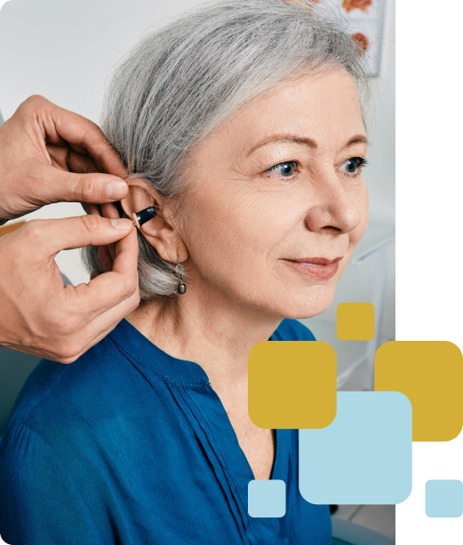 Elderly woman with hearing aid